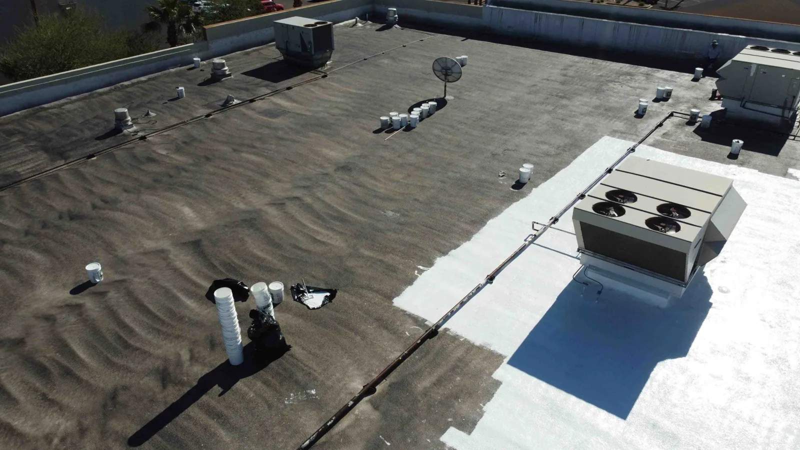 Commercial roof replacement crew on a Torrance low-slope roof Commercial roof replacement crew on a Torrance low-slope roof